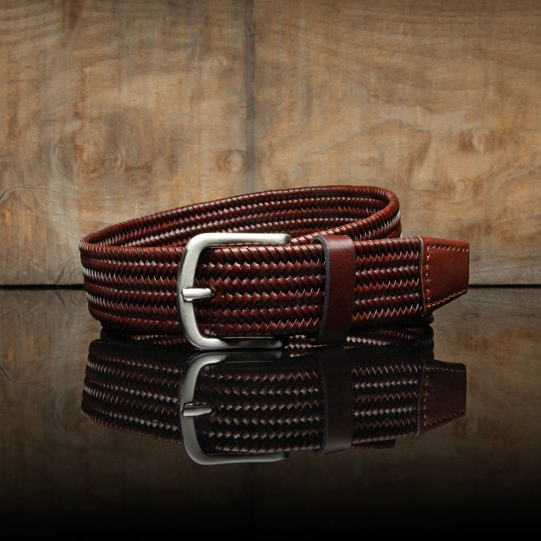 Dark brown braided belt made of saddle leather